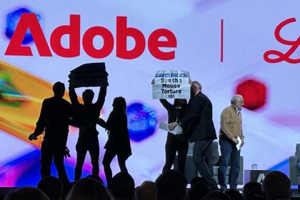 Protestors Storm Stage At Adobe Summit