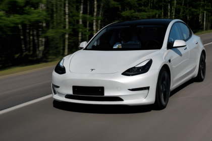 Tesla driving along a road